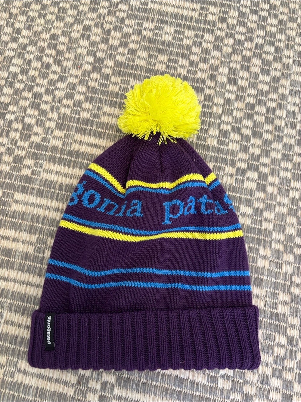 Patagonia Purple Beanie with Yellow Pom and Blue Accents